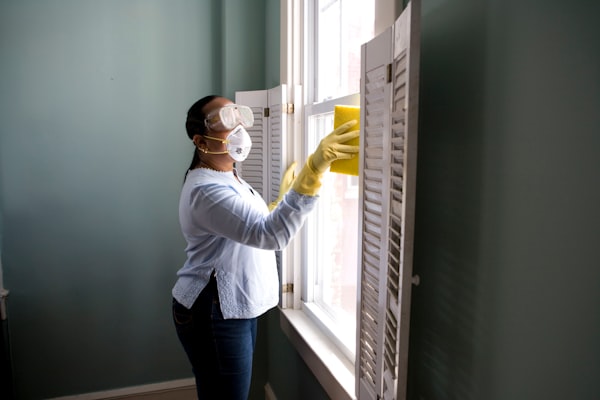 Professional commercial cleaning team sanitizing a modern office workspace